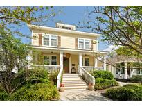 Charming two-story home with a welcoming front porch and manicured landscaping at 1012 Ashley Ave, Charleston, SC 29403