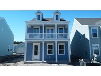 Charming two-story home featuring a balcony and a light blue exterior at 213 Terrace View Dr, Summerville, SC 29486