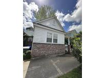 Charming single-story home with white siding and brick foundation, complemented by a well-maintained front yard at 227 Fishburne St, Charleston, SC 29403