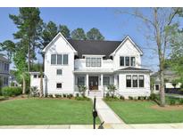 Beautiful two-story home featuring a manicured lawn and a welcoming entryway at 2805 Stay Sail Way, Mount Pleasant, SC 29466