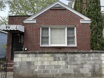 Charming brick facade with a window on a lovely classic home at 3 Woodall Ct, Charleston, SC 29403