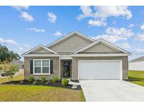 Charming brick home with a two-car garage and well-maintained landscaping at 369 Spruce Ivy St, Moncks Corner, SC 29461
