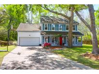 Charming two-story home featuring a welcoming front porch and manicured lawn at 1255 Horseshoe Bnd, Mount Pleasant, SC 29464