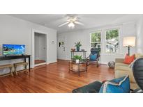 Bright living room with hardwood floors and modern furnishings, perfect for relaxing or entertaining at 17 8Th Ave # 17G, Charleston, SC 29403