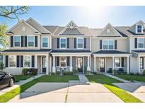 Charming townhouses with inviting front porches, landscaping, and black shutters, offering curb appeal at 202 Kirkland St, Goose Creek, SC 29445