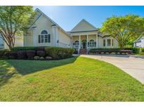 Charming single-Gathering home with lush front lawn, beautiful landscaping, and inviting curb appeal at 3502 Stockton Dr, Mount Pleasant, SC 29466