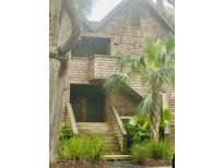 Charming shingle-style home with multiple entrances and mature trees, providing a welcoming ambiance at 4262 Mariners Watch, Kiawah Island, SC 29455