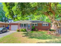 Charming brick ranch-style home with mature trees and a welcoming front porch at 5319 Mcroy St, North Charleston, SC 29418