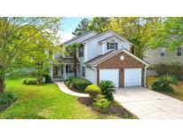 Charming two-story home with a two-car garage, a landscaped front yard, and a welcoming entryway at 192 Bamert St, Summerville, SC 29483