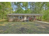 Charming single-story brick home with well-maintained landscaping and a welcoming entrance at 202 Oak Cir, Walterboro, SC 29488