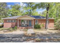 Charming single-story brick home with a welcoming front porch and well-maintained landscaping at 237 Cypress Dr, Walterboro, SC 29488