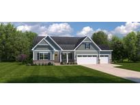 Charming home featuring a three-car garage, stone accents, and lush landscaping at 1022 Lacebark Dr, Ridgeville, SC 29472