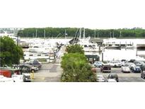 Waterfront marina view showcasing boat slips, various boats, and parking at 14 Lockwood Dr # 2E, Charleston, SC 29401