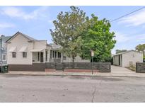 Charming home featuring a fenced yard, mature trees, and convenient off street parking at 24 Hanover St, Charleston, SC 29403