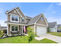Charming two-story home with a well-manicured lawn and an attached garage in a friendly neighborhood at 476 Foxbank Plantation Blvd, Moncks Corner, SC 29461