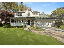 Charming two-story traditional home with a welcoming front porch and beautifully landscaped yard at 739 Stiles Dr, Charleston, SC 29412
