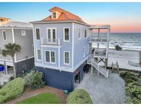 Beautiful oceanfront home featuring multiple decks, beach access, and spacious outdoor living at 1681 E Ashley Ave # B, Folly Beach, SC 29439