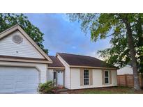 Charming one-story home with attached garage, well-maintained lawn, and inviting curb appeal in a quiet neighborhood at 315 Indigo Rd, Goose Creek, SC 29445