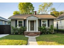 Charming home with landscaped front yard, brick entryway, and inviting front door at 40 Dunnemann Ave, Charleston, SC 29403
