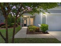 Charming home exterior with landscaped front yard and inviting entrance at 505 Eastern Isle Ave, Summerville, SC 29486