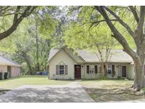 Charming single-story home with a well-manicured lawn and mature trees, offering a welcoming curb appeal at 621 Temple Rd # A, Ladson, SC 29456