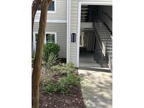 Exterior view of building with visible unit numbers and access to upper levels at 1300 Park West Blvd # 516, Mount Pleasant, SC 29466
