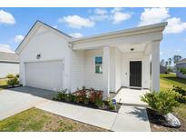 Charming single-story home with a well-manicured lawn and inviting entrance at 412 Pender Woods Dr, Summerville, SC 29486