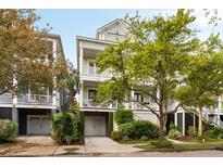 Charming two-story home with a well-manicured lawn and covered porch at 158 Mary Ellen Dr, Charleston, SC 29403