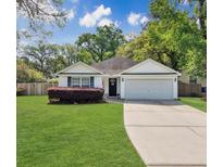 Charming one story home with well maintained lawn, two car garage, and beautiful landscaping at 1921 Old Parsonage Rd, Charleston, SC 29414