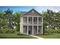 Charming two-story home with gray siding, white trim, inviting front porch, and manicured landscaping, creating great curb appeal at 320 Archar St, Summerville, SC 29486