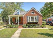 Charming brick home with a landscaped front yard and inviting porch at 45 Lyttleton Ave, Charleston, SC 29407