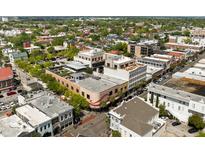 A vibrant aerial view of a charming commercial building with roof top patios and downtown surrounding in Charleston, SC at 517 King St # 1, Charleston, SC 29403