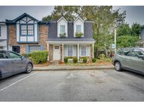 Charming townhome with a well-manicured lawn, dormer windows, and parking at 668 Buckhall Ct # D, Mount Pleasant, SC 29464
