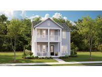 Charming two-story home with a welcoming porch and a beautiful, landscaped front yard at 1427 Clay Field Trl, Summerville, SC 29485