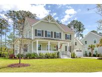 Charming two-story home with a welcoming front porch and well-manicured lawn at 1755 Bolden Dr, Mount Pleasant, SC 29466