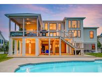 Stunning backyard featuring a multi-level deck and inviting in-ground pool, perfect for relaxation and entertaining at 2732 Canebreak Ln, Mount Pleasant, SC 29466