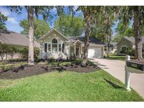 Charming single-story home with well-manicured lawn, classic design, and inviting curb appeal at 9146 Spring Branch Ct, North Charleston, SC 29406