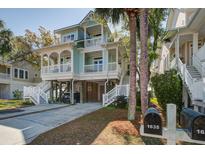 Inviting two-story beach house with double porches and beautiful landscaping at 1637 Folly Creek Way # E-12, Charleston, SC 29412