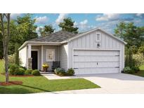 Charming single-Gathering home with a well-manicured lawn, classic siding and a two car garage at 323 Pine Crest View Dr, Summerville, SC 29486