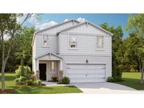 Charming two-story home featuring a white exterior, attached garage, and beautifully landscaped front yard at 339 Pine Crest View Dr, Summerville, SC 29486