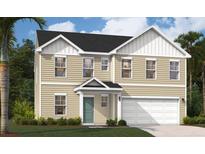 Charming two-story home with a bright teal door and a two car garage at 4163 Rising Tide Dr, Summerville, SC 29485