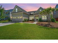 Charming home with a two-car garage, manicured lawn, and inviting front porch at 521 Yellow Tower Ter, Charleston, SC 29412
