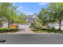 Charming home with a two-car garage, well-manicured lawn, mature trees, and attractive curb appeal at 9670 Pebble Creek Blvd, Summerville, SC 29485