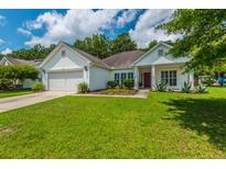 Charming one-story home with a well-kept lawn and convenient two-car garage at 107 Towering Pine Dr, Ladson, SC 29456