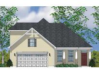 Charming home featuring a two-car garage, stone accents and well-manicured landscaping at 113 Seaton St, Summerville, SC 29486