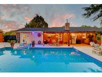 Inviting backyard pool and patio with outdoor seating, perfect for entertaining under the string lights at 2506 Birkenhead Dr, Charleston, SC 29414