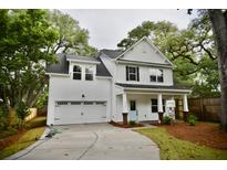 Charming two-story home with a light blue front door and a manicured front lawn at 1178 Braddock Ave, North Charleston, SC 29406