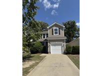 Charming two-story home features a one-car garage, neutral siding, and a well-maintained front yard at 1208 N University Dr # A, Ladson, SC 29456