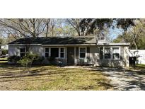 Charming single-story home featuring a cozy front porch and well-maintained landscaping at 125 Matheny Dr, Goose Creek, SC 29445