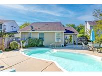 Backyard pool featuring a patio area with an outdoor dining set, perfect for relaxation and entertaining at 1929 Treebark Dr, Charleston, SC 29414